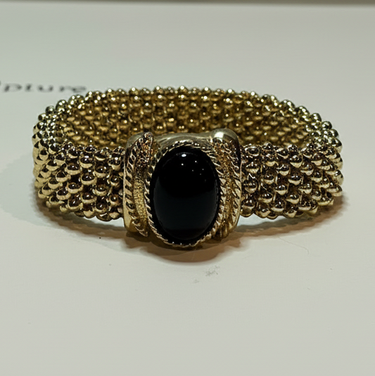 Vintage Elizabeth Taylor “White Diamonds” Gold-Tone Bracelet with Black Cabochon
